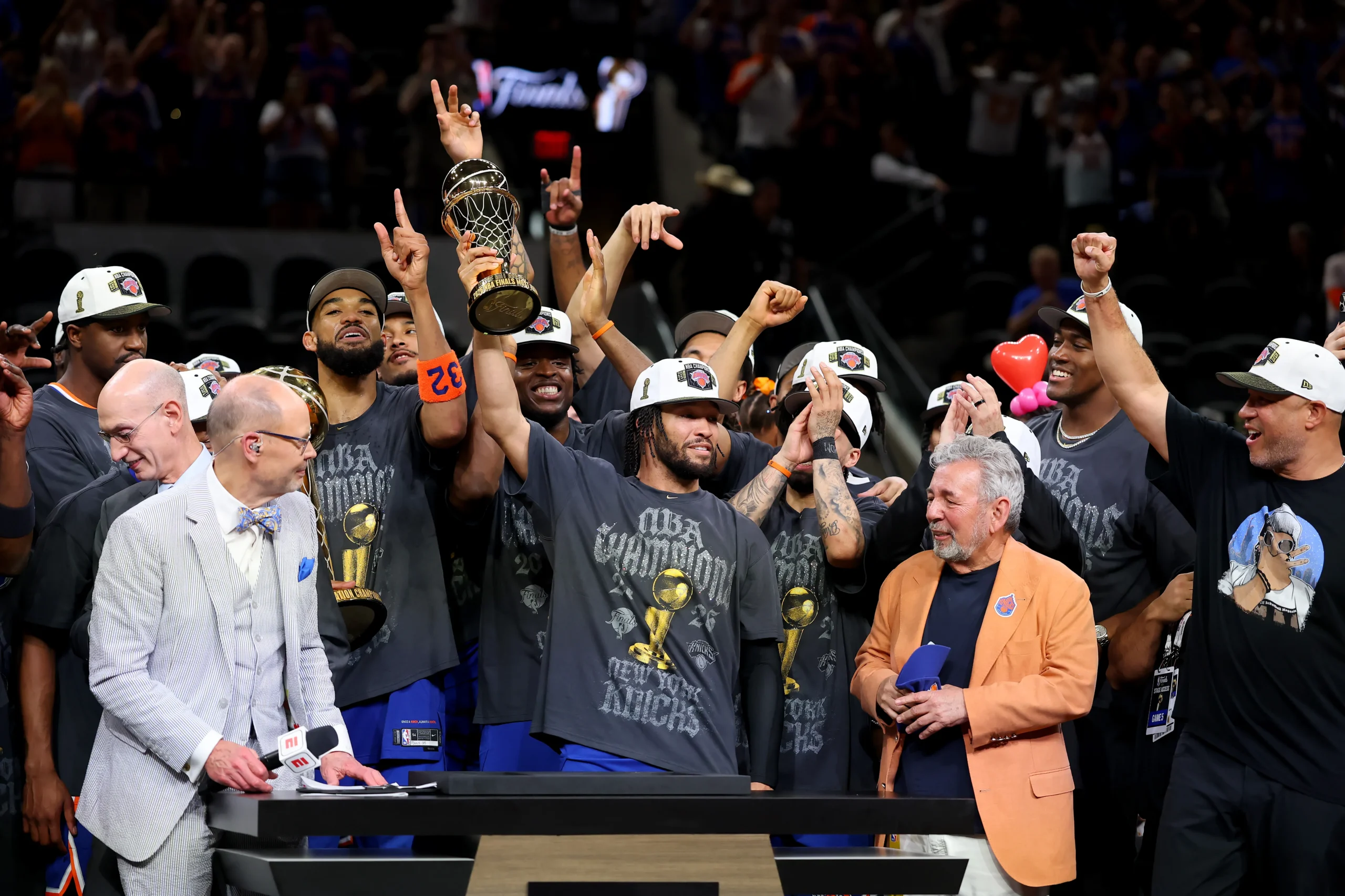 New York Knicks players celebrating with the NBA Championship trophy after defeating the San Antonio Spurs, symbolizing perseverance, teamwork, comeback victories, and overcoming the odds after a 53-year title drought.